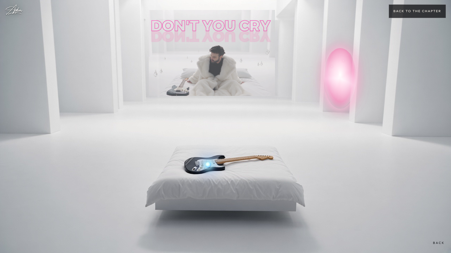 A pale room with a bed, a white coat, and a guitar.